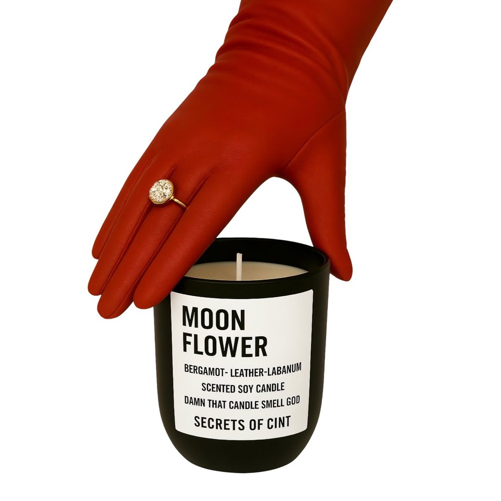 Moon Flower signature soy candle in a black glass vessel with wood lid